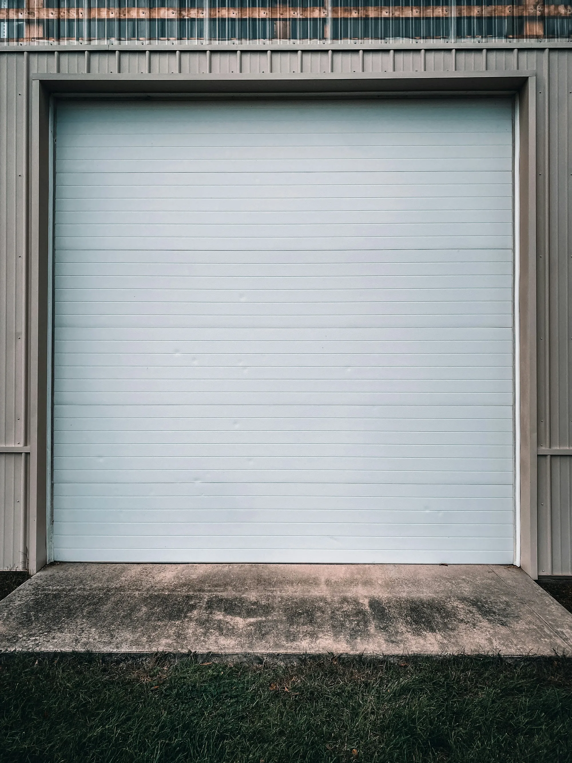 Closed white roll-up door seen straight on